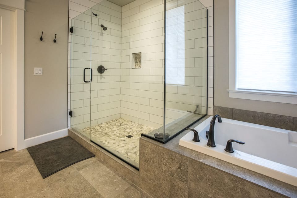 Luxurious tub and shower arrangement provides a spa-like experience