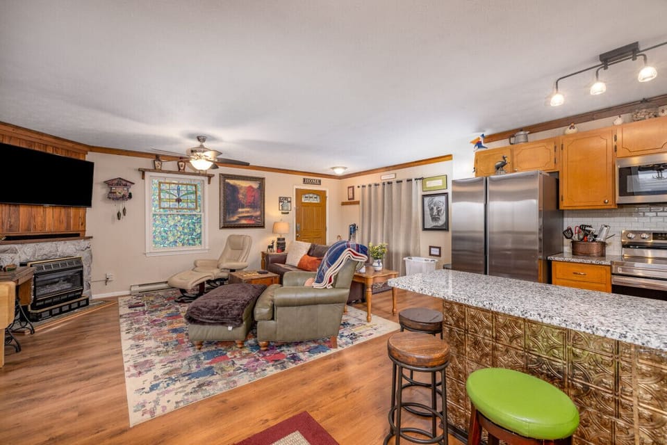 Our open floor layout seamlessly connects the living room, complete with a gas fireplace, to a well-appointed kitchen, ideal for cooking up delicious meals.