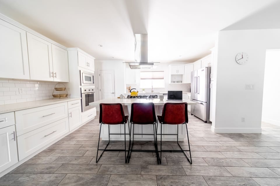 Kitchen island with 3 leather bar stools