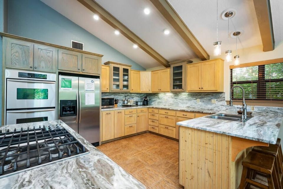 Cook, dine, and unwind with stunning Comal River views just beyond the kitchen