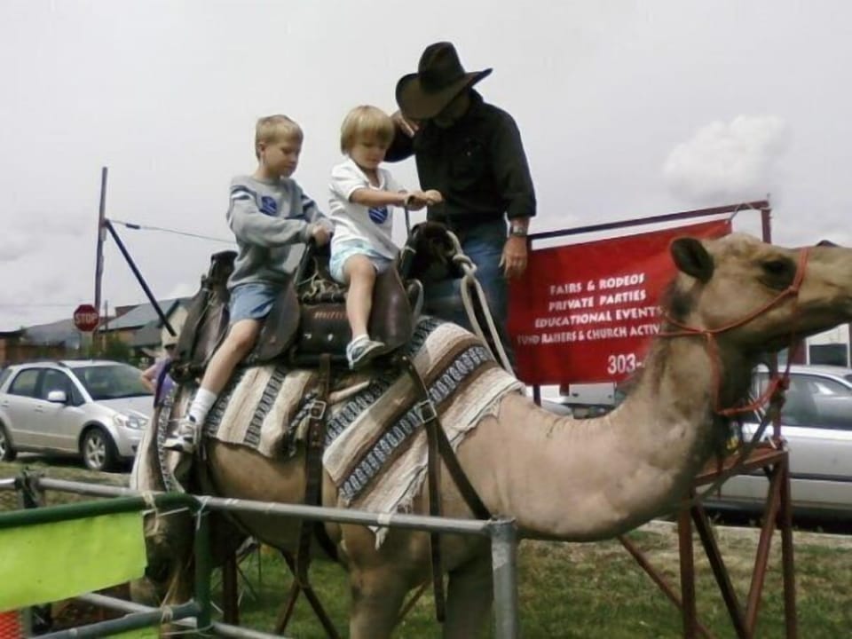 Kids having fun at burro days.  Not just burros at burro days!