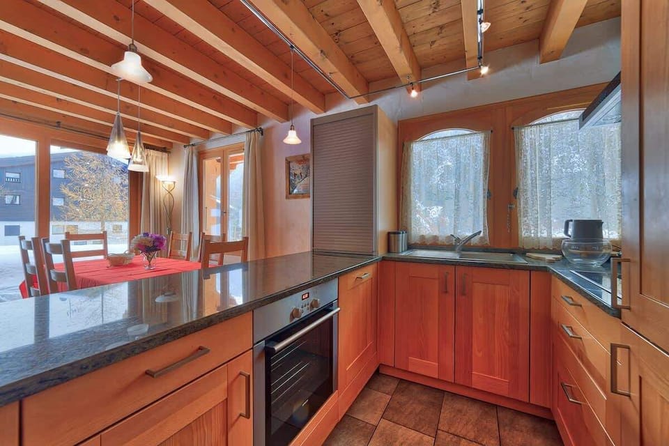 Fully fitted kitchen looking out to the dining area.