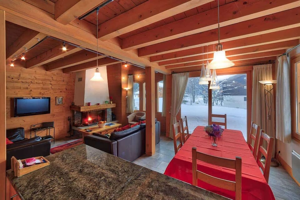 Open Plan Living Area with log fire ~ Living/Dining and Kitchen Area.