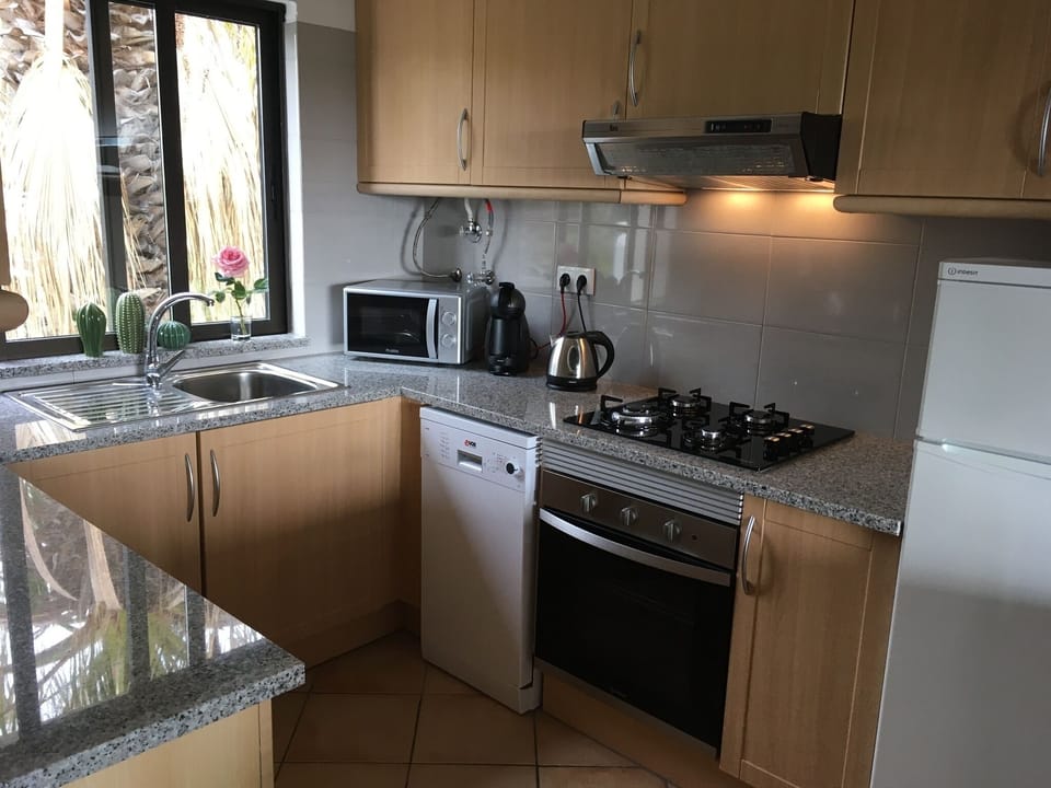 Refurbished kitchen including dishwasher, coffee maker, microwave, oven and hob