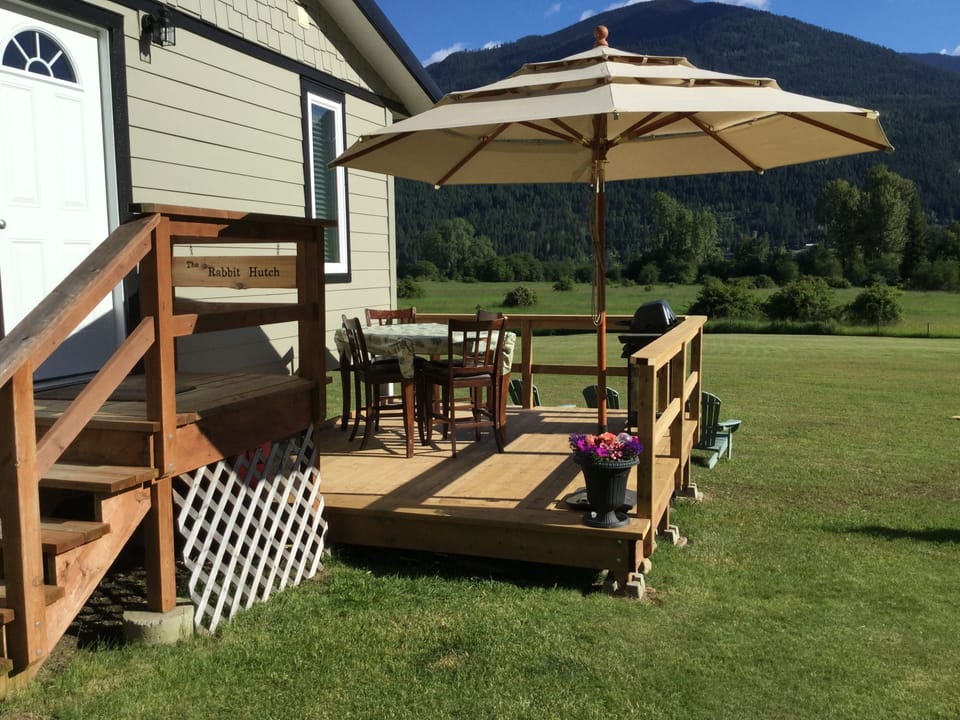 Shade umbrella on your private deck with BBQ grill.