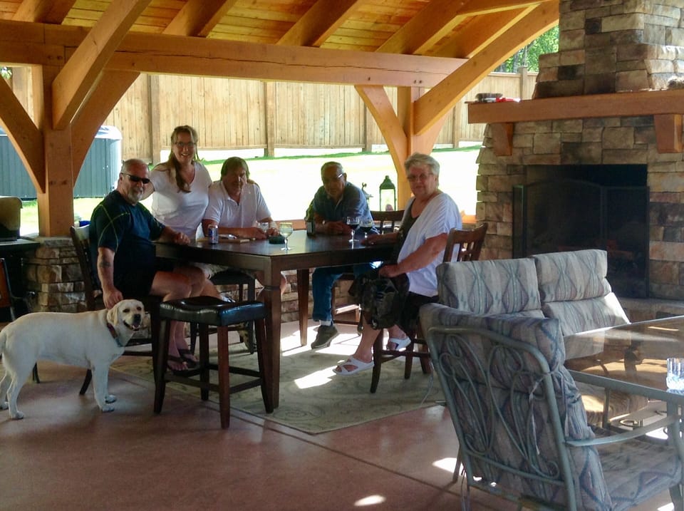 Shared covered patio with seating for 12.