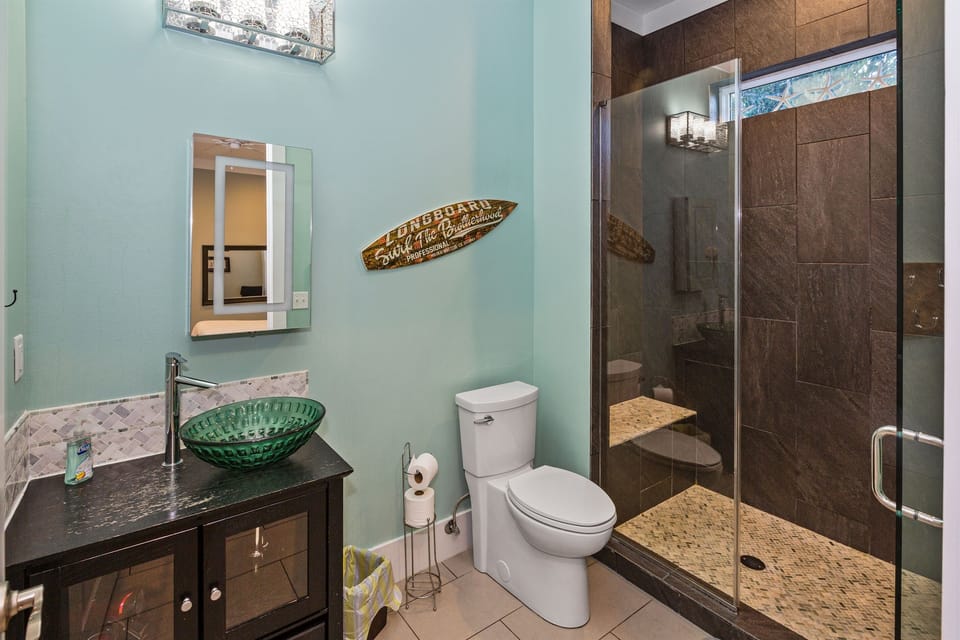 Modern first floor private bath attached to second king suite.