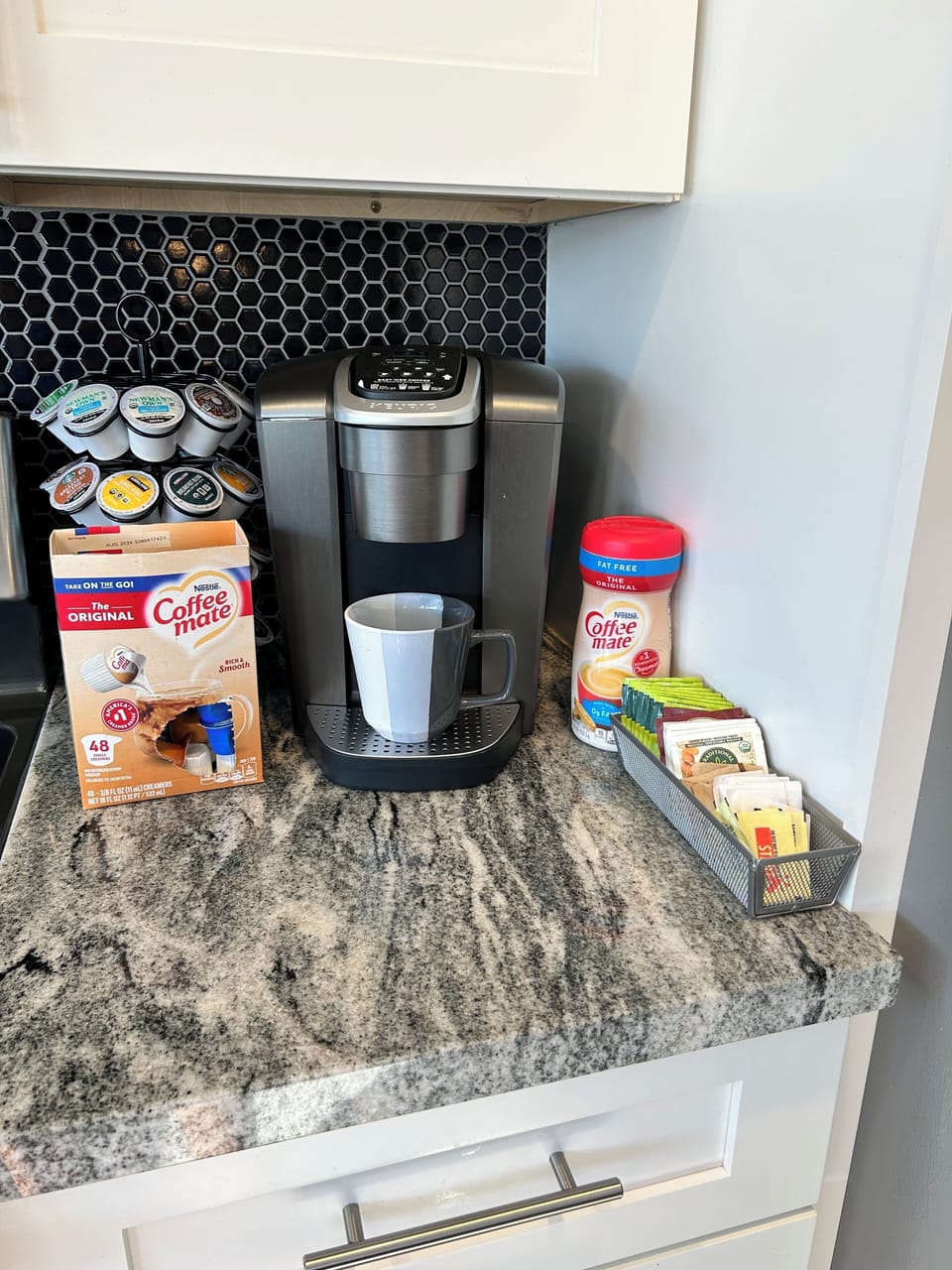 Keurig coffee station with creamer, sugar/sweeteners and tea