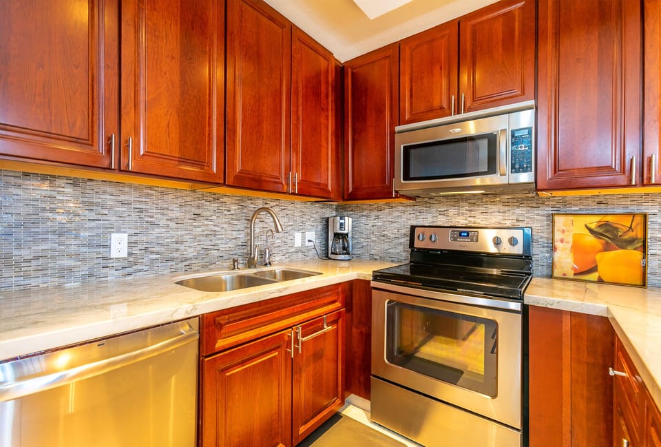 Kitchen filled with appliances~ dishware and utensils
