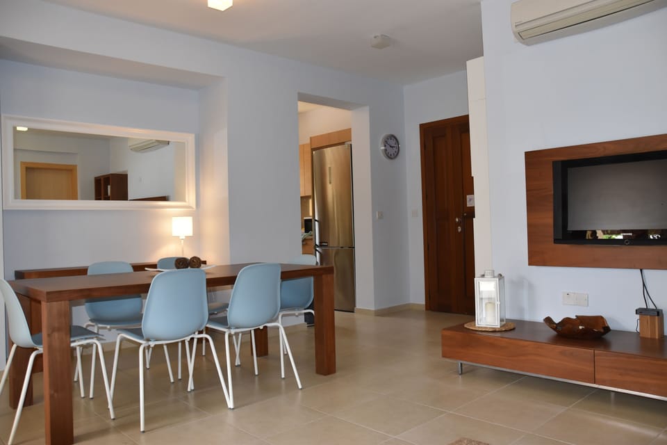 the living room with wood table 6/8 people