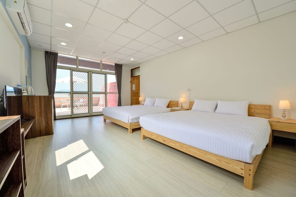 Standard Quadruple Room, 2 Queen Beds, Non Smoking | Blackout drapes, free WiFi, bed sheets