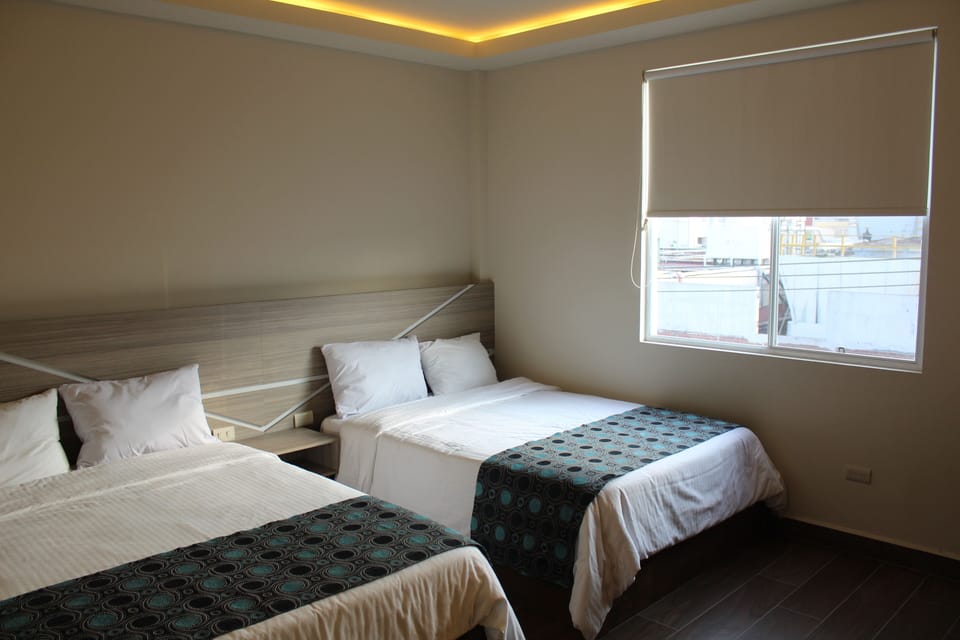 Deluxe Room, 2 Twin Beds | Laptop workspace, WiFi (free), bed sheets
