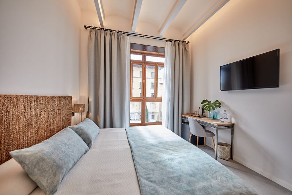 Standard Double Room | Minibar, in-room safe, desk, blackout drapes