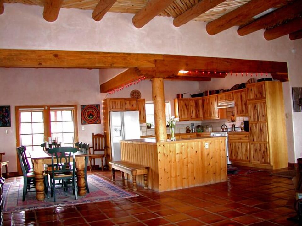 View from front entry shown high vigas and latilla's