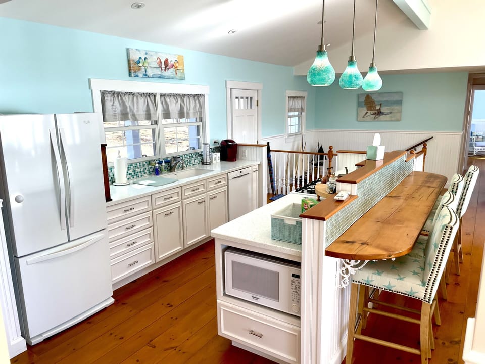 Galley Kitchen with dining counter. 