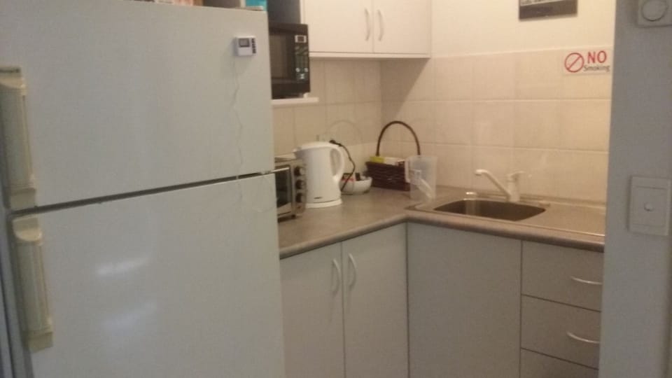 Kitchenette with full size fridge, microwave & portable hotplates