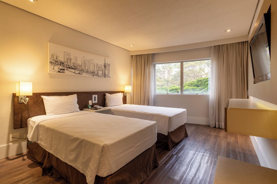 Deluxe Room, 2 Twin Beds | Minibar, in-room safe, desk, blackout drapes