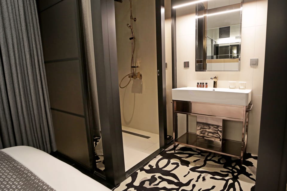 Signature Room | Bathroom | Shower, hair dryer, bathrobes, slippers