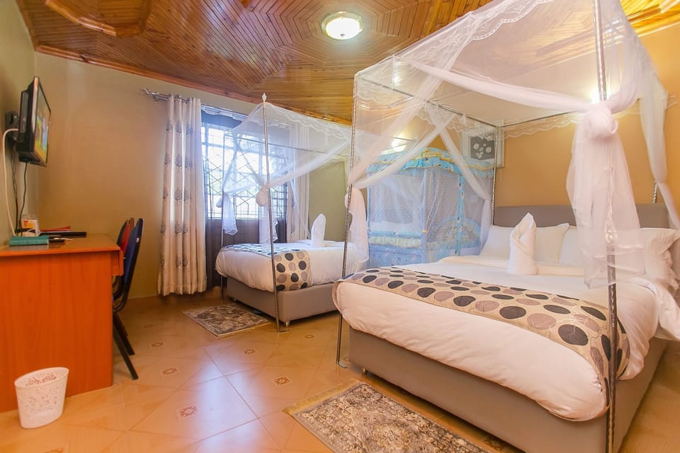 Family Room, 2 Double Beds | 5 bedrooms, in-room safe, desk, laptop workspace