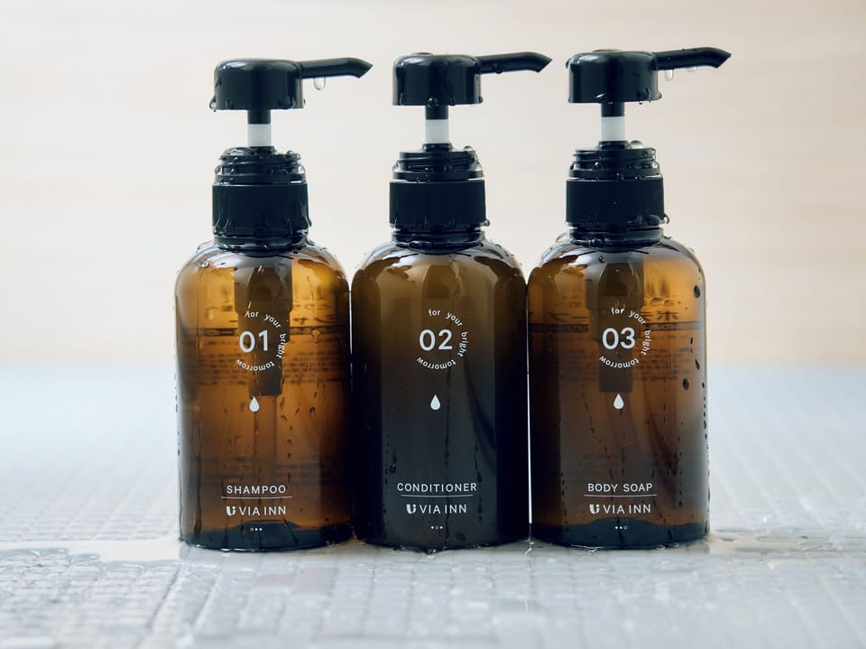 Eco-friendly toiletries, hair dryer, slippers, bidet
