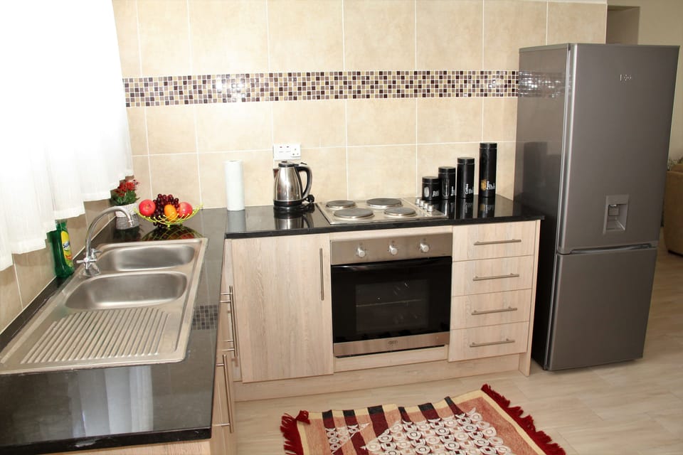 Family Apartment, Multiple Beds, Non Smoking, Garden View | Private kitchen | Fridge, microwave, oven, cookware/dishes/utensils