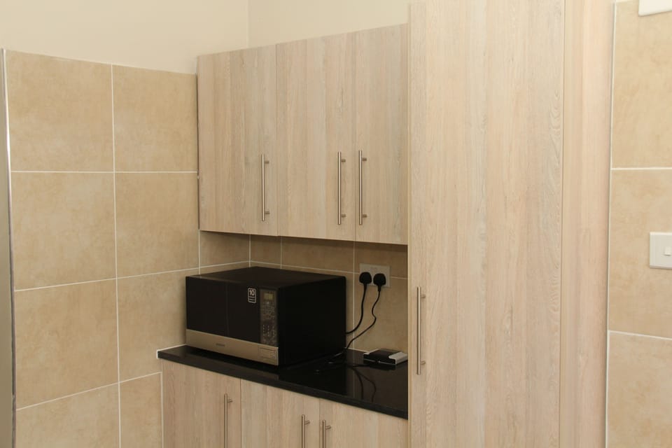 Family Apartment, Multiple Beds, Non Smoking, Garden View | Private kitchen | Fridge, microwave, oven, cookware/dishes/utensils