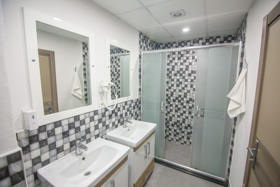 Shower, rainfall showerhead, designer toiletries, hair dryer