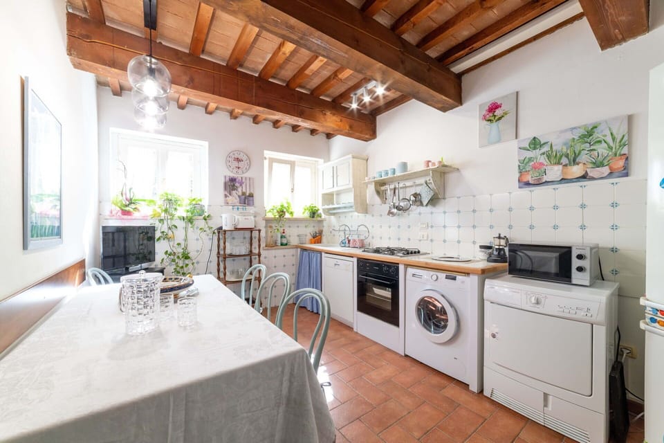 Furniture, Cabinetry, Table, Countertop, Kitchen Appliance, Kitchen Stove, Wood, Interior Design, Kitchen, Flooring