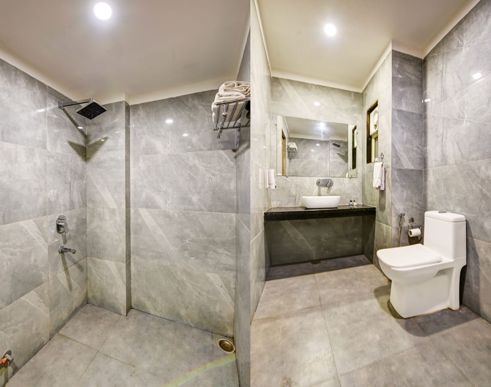 Shower, rainfall showerhead, designer toiletries, hair dryer