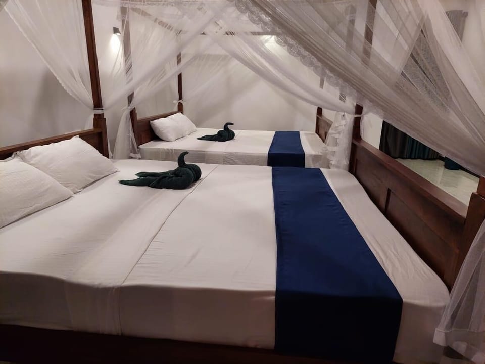 Family Room, Air conditioning, Lagoon View | Premium bedding, desk, laptop workspace, WiFi (free)