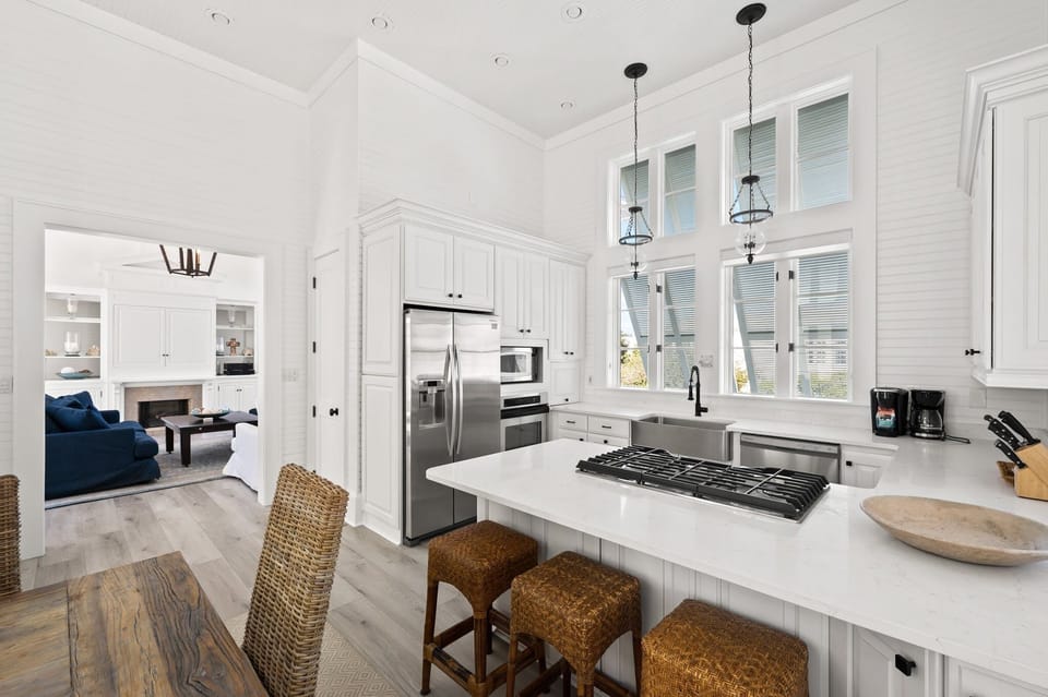 Chef's Kitchen with Natural Lighting, Luxury Quartz Island, and Soaring Double-Height Windows