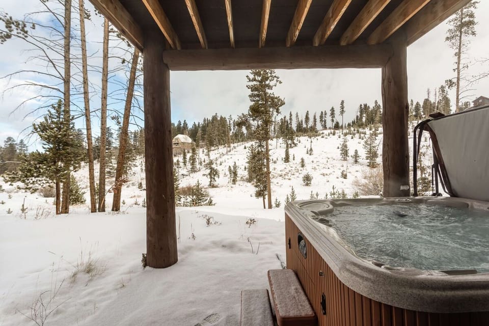 Relax in the private hot tub on the lower level patio