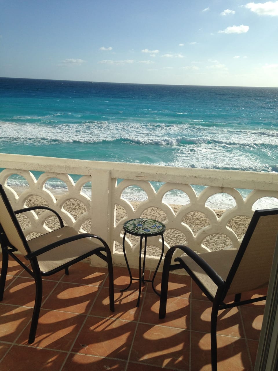 Coffee, meals, people watching, a night cap, etc., all on newly tiled balcony.