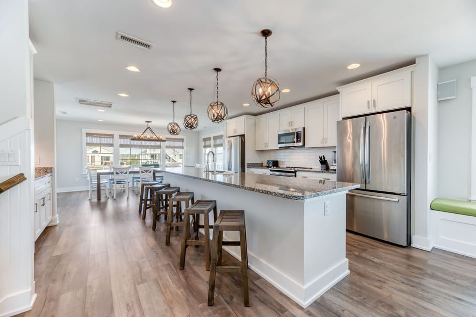 Kitchen with Bar Stool Seating on Third Level