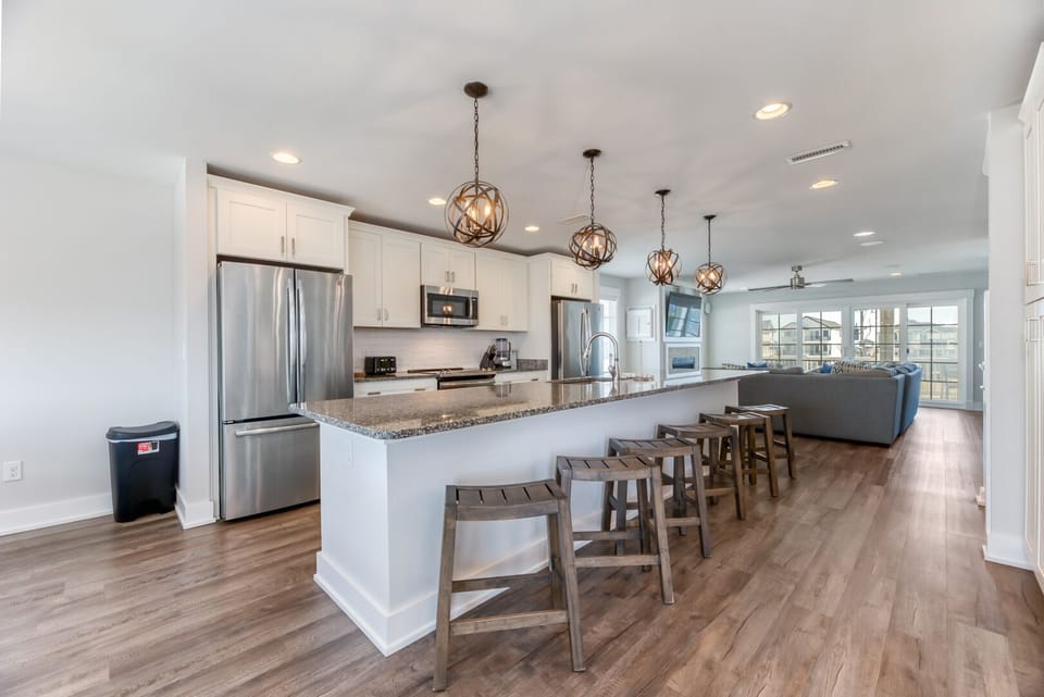 Kitchen with Bar Stool Seating on Third Level