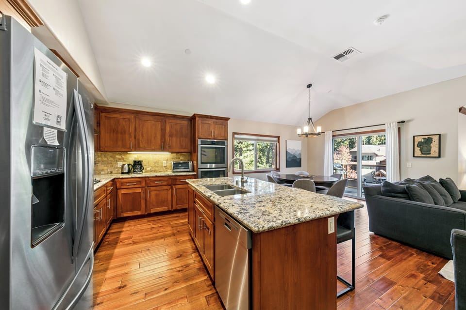 Your spacious open-plan kitchen flows seamlessly into the living area, perfect for cooking and socializing together.
