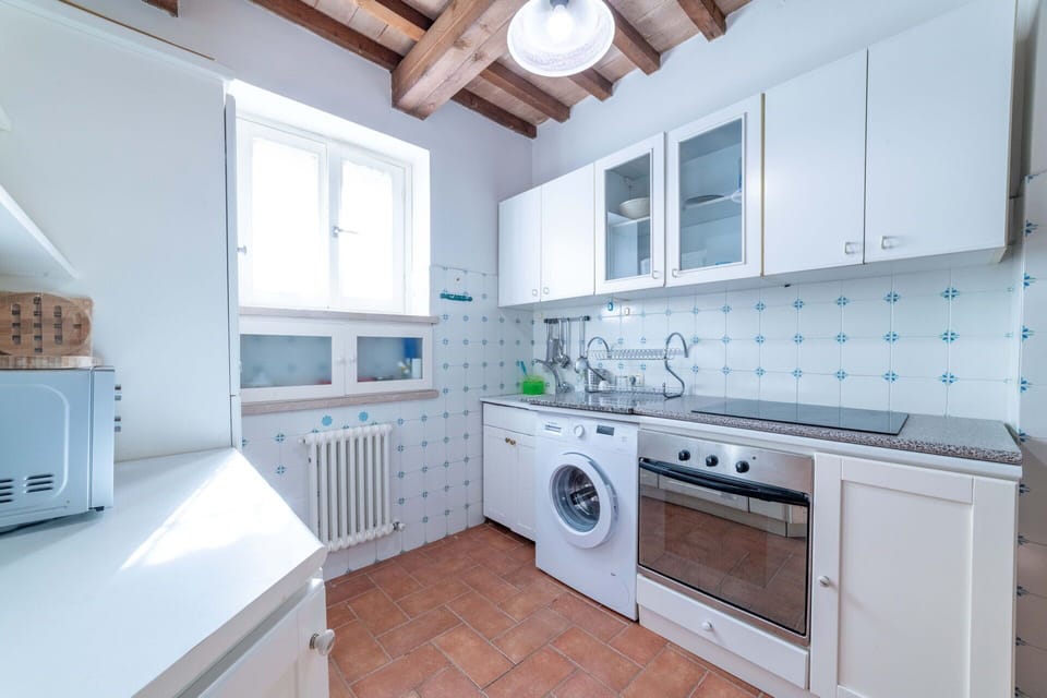 Cabinetry, Countertop, Property, White, Kitchen Stove, Kitchen, Kitchen Appliance, Lighting, Interior Design, Stove