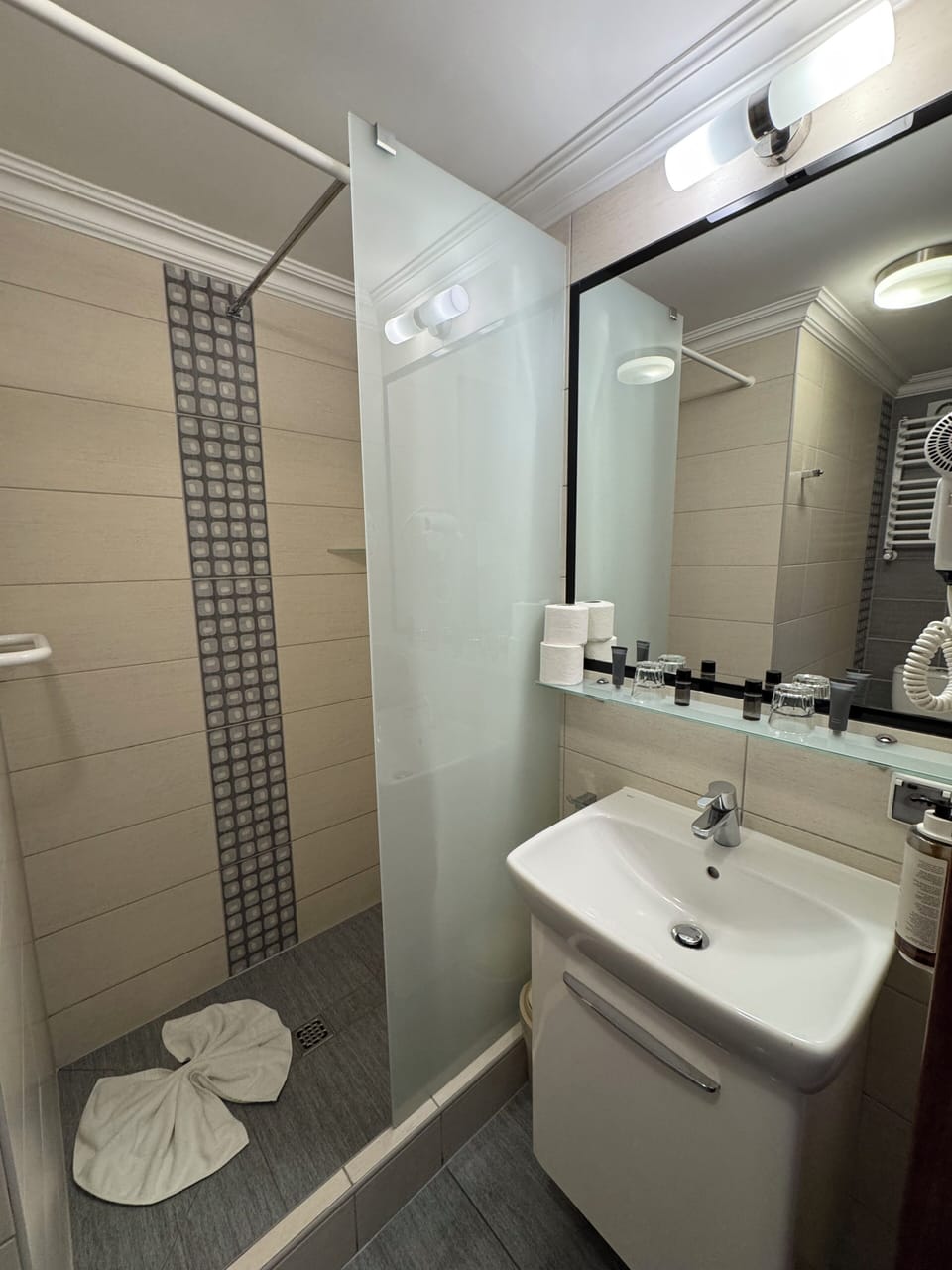 Shower, hair dryer, towels, soap