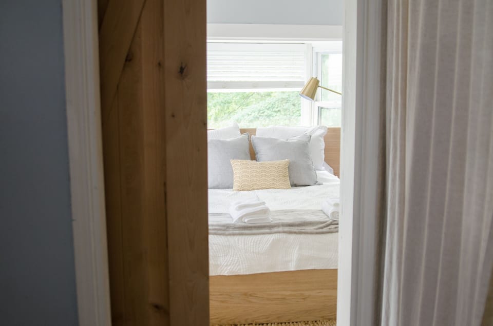 A barnwood door separates the master from the rest of the house.