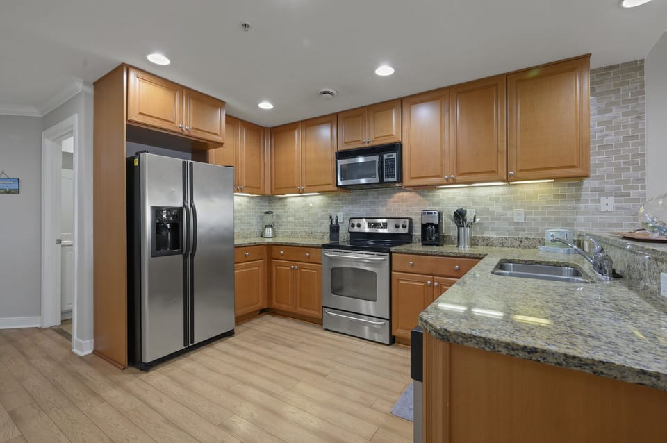 Gourmet Kitchen with Granite & Stainless Appliances.