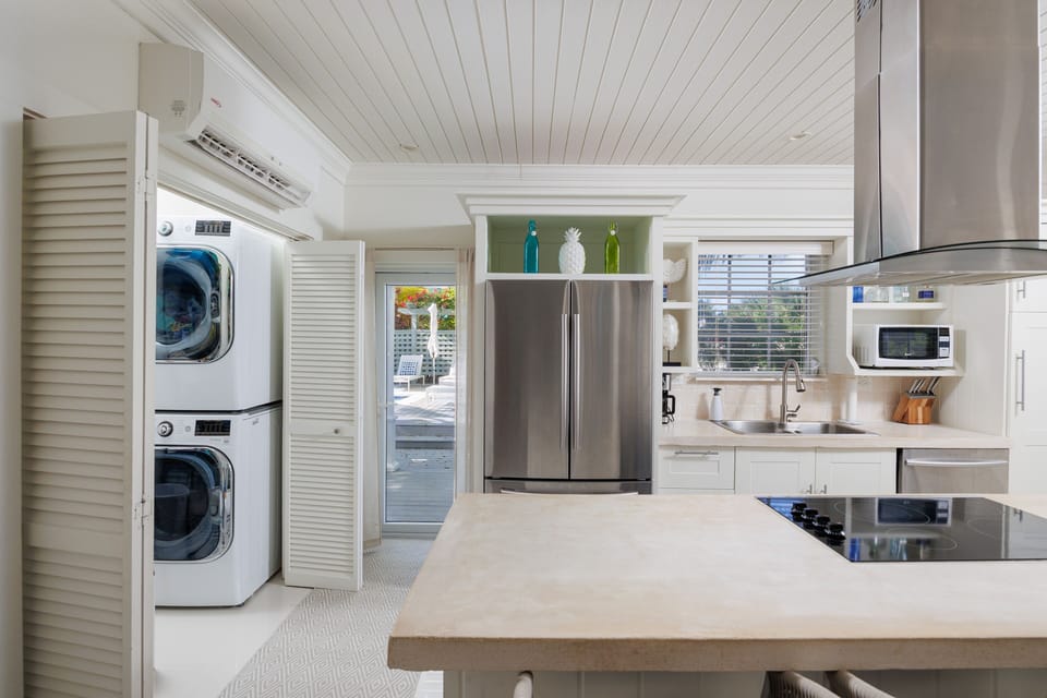 There is a laundry room off the great room with a washer and dryer.