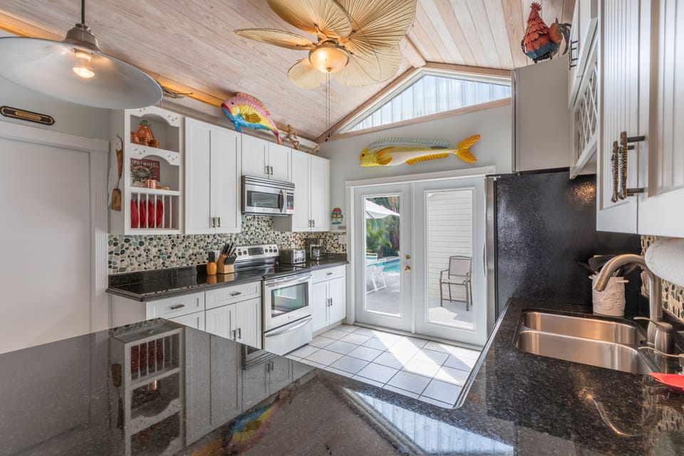 French doors that lead to the outdoor entertainment area