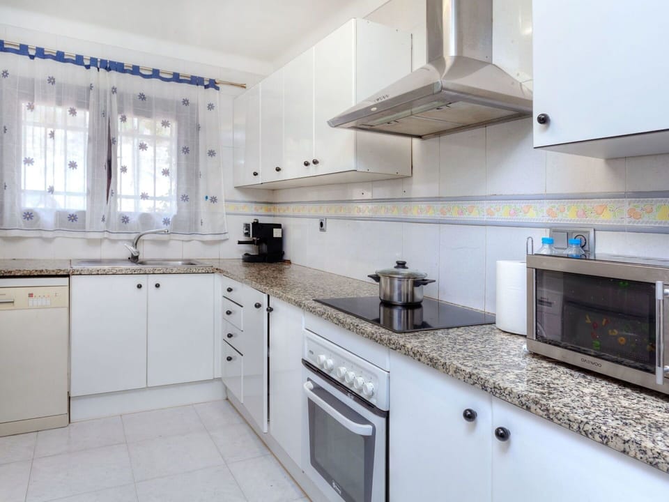 Countertop, Property, Room, White, Kitchen, Cabinetry, Furniture, Interior Design, Tile, Building
