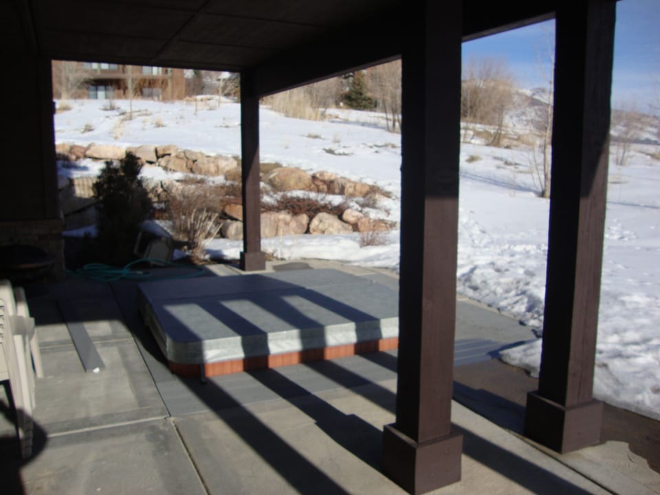 Hot Tub on Downstairs walk-out covered Patio with a view of Pineview Reservoir.