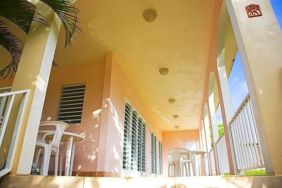 Side porch leads to enclosed laundry room