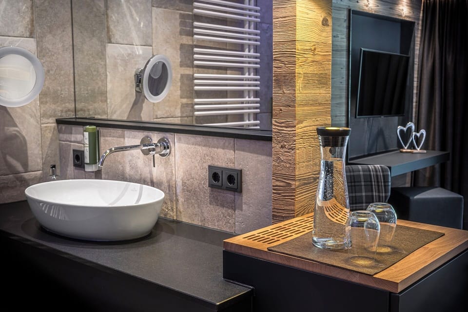 Deluxe Double Room, Balcony, Mountain View | Bathroom | Shower, hair dryer, bathrobes, heated floors