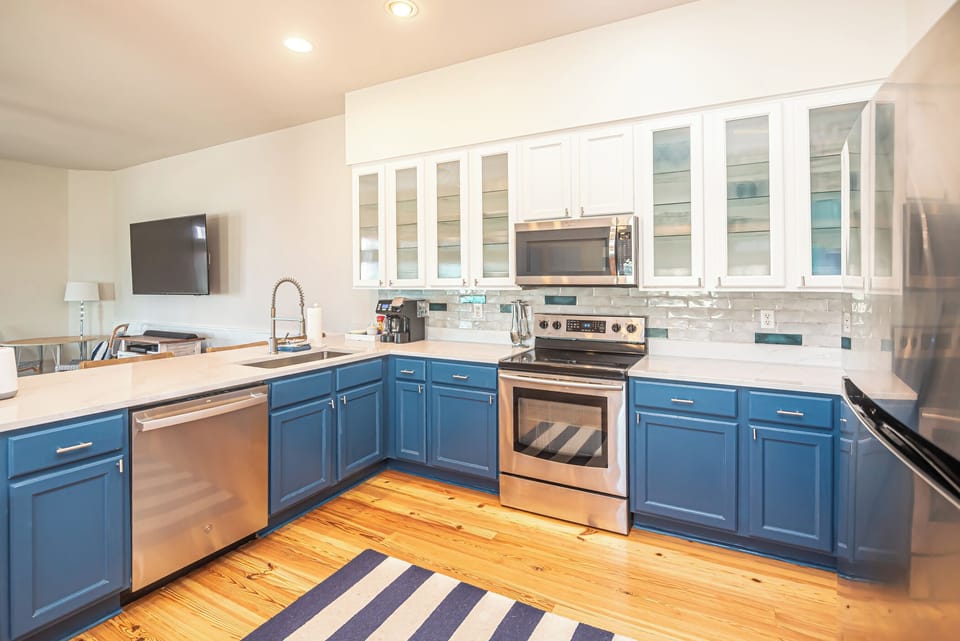 Remodeled kitchen with new Quartz countertop large sink, painted cabinets