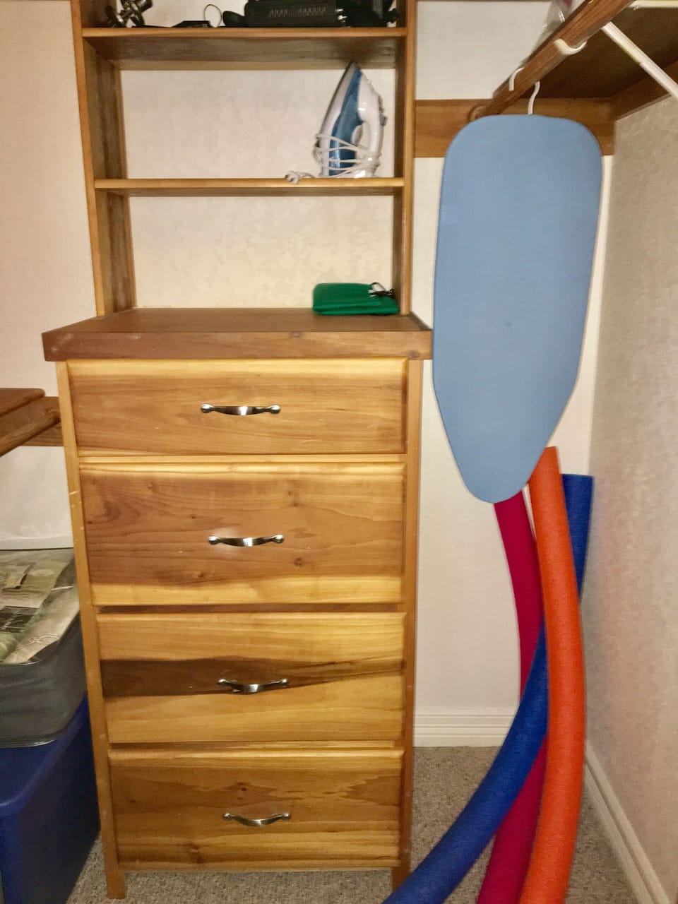 Iron, ironing board, noodles in master closet