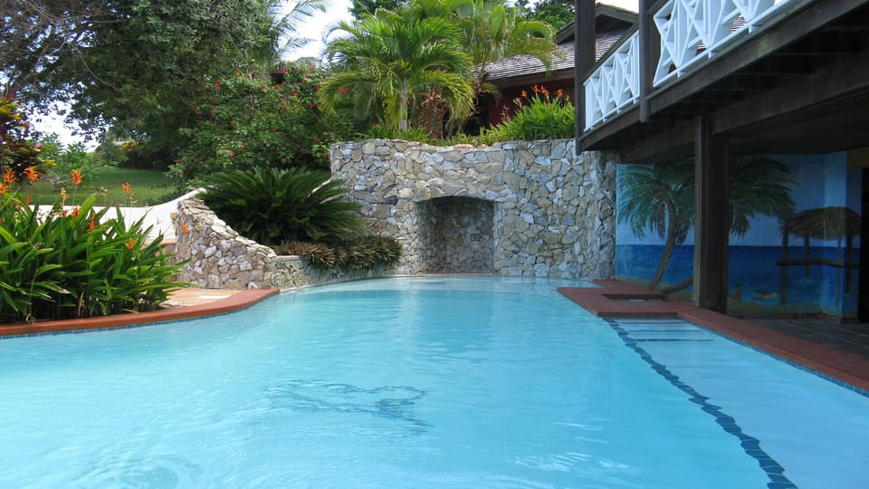The pool has a bar/snack area and powder room.