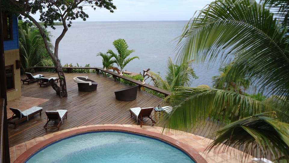 Private pool  with large deck overlooking the sea